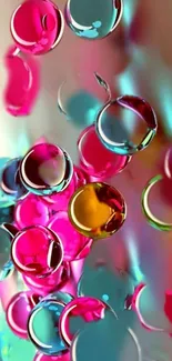 Colorful abstract bubbles with pink, blue, and yellow hues on a phone wallpaper.