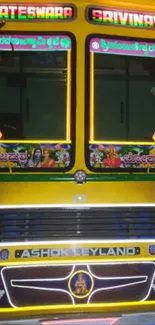 Detailed vibrant yellow Indian bus design with cultural artwork