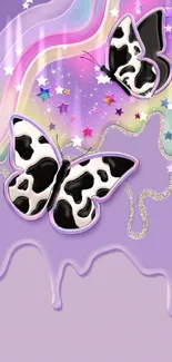 Vibrant wallpaper with cow-pattern butterflies and rainbow background.