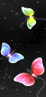 Colorful butterflies flutter on a starry black night sky wallpaper.