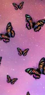 Colorful butterfly wallpaper with pink glittery sky.