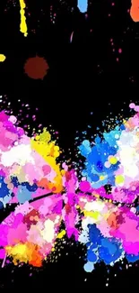 Colorful abstract butterfly with vibrant splashes on a black background.