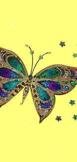 Intricate gemstone butterfly on yellow background.