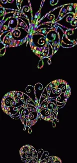 Colorful butterfly art on a black background, vibrant and psychedelic.