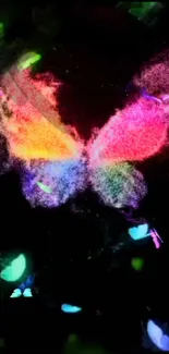 Vibrant neon butterfly with glowing colors on black background.