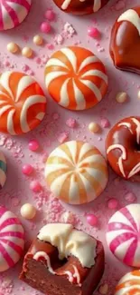Vibrant candies and sweets on a pink background.