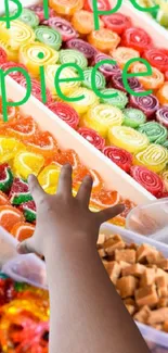 A hand reaching for colorful candies in an assortment of vibrant colors.