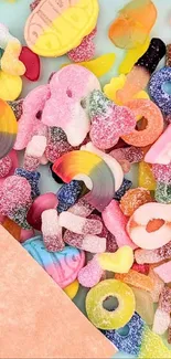 Colorful gummy candies and pastel elements on wallpaper.