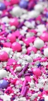 Colorful candy-themed wallpaper with pink and purple stars.