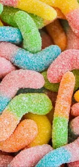 Colorful gummy worms with sugar coating, vibrant wallpaper.