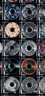 Mobile wallpaper with colorful CD collection in a grid.