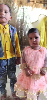 Children in vibrant outfits posing cheerfully indoors.