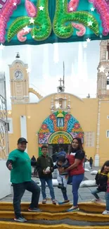 Family posing at a colorful church entrance with vibrant decorations.