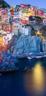 Colorful Cinque Terre coastline at sunset with vibrant buildings and blue sea.