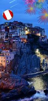 Colorful cliffside village with fireworks at twilight.