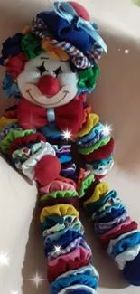 Colorful clown doll with layered fabric on neutral background.