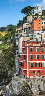 Colorful Italian coastal village overlooking the ocean, perfect for mobile wallpaper.