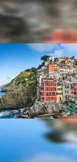 Colorful Italian coastal town with cliffside homes and clear blue skies.