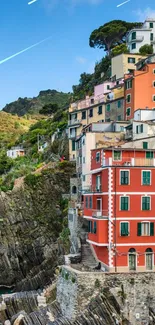 Colorful buildings on a coastal cliff in Italy.