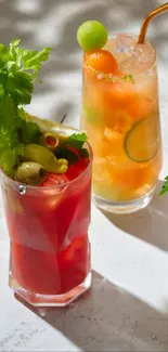 Colorful cocktails on a light stone background.