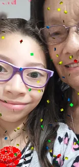 Joyful colorful confetti selfie with glasses and smiles.