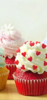 A variety of colorful cupcakes with decorative frosting on display.