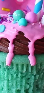 Vibrant cupcake with pink icing and colorful decorations.