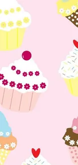 Colorful, cute cupcakes on a pink background.