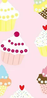 Colorful cupcakes on a pink background wallpaper.