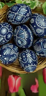 Decorated Easter eggs in a wicker basket with tulips.