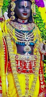 Colorful deity adorned with vibrant clothing.