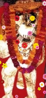 Deity image with colorful garlands and vibrant floral decorations.