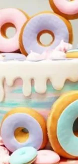 Colorful pastel donut cake with icing and decorations.