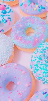 Mobile wallpaper with colorful donuts in light purple hues.