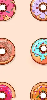 Colorful donuts on a peach background wallpaper.