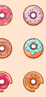 Colorful donut pattern on peach background wallpaper.