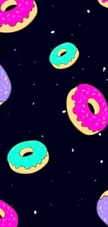 Vibrant wallpaper with colorful donuts on a dark background.