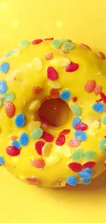 Yellow donut with colorful sprinkles on a vibrant background.