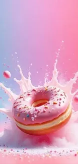 Vibrant pink donut splashing on gradient background.