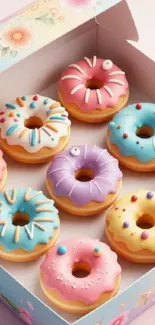A box of colorful frosted donuts in pastel colors.