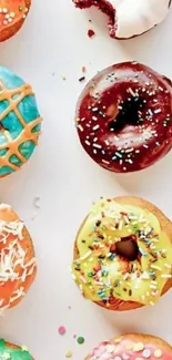 Vibrant mobile wallpaper of assorted colorful donuts with sprinkles.