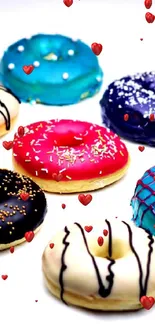 Colorful donuts with icing on white background.