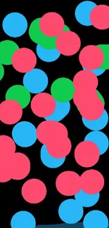 Colorful dots on a black background wallpaper.