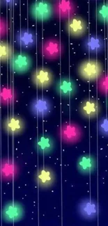 Colorful hanging stars on a deep blue night background.