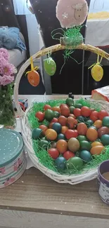 Basket of colorful Easter eggs on table.