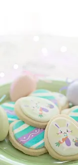 Easter cookies on a pastel green plate with colorful designs.