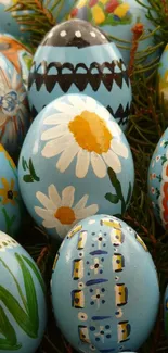 Colorful Easter eggs with floral designs on a blue background.