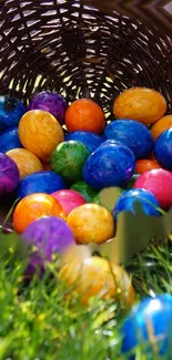 Vibrant basket of Easter eggs on grass.