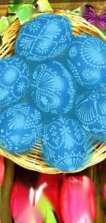 Blue Easter eggs in a woven basket with floral accents and butterflies.