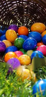 Basket of colorful Easter eggs on green grass.